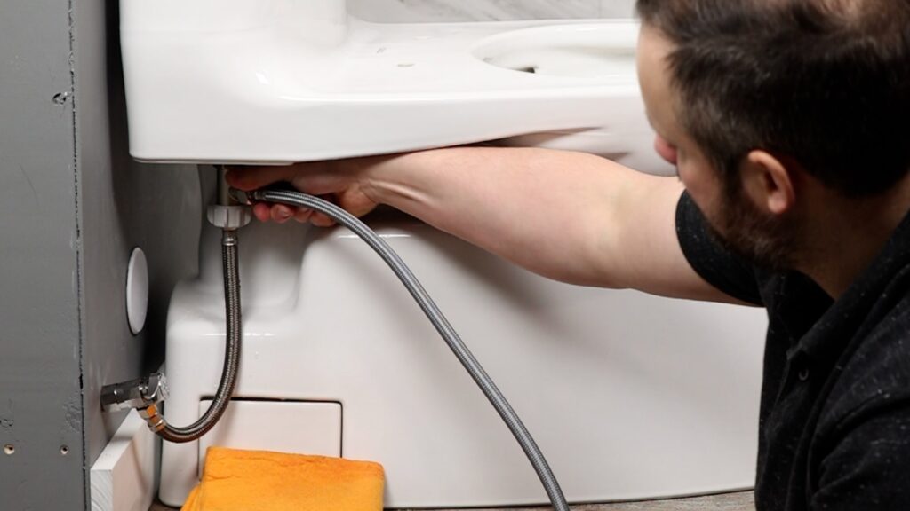 Bidet installation: connect t-connector to toilet tank and attach the toilet and bidet hoses